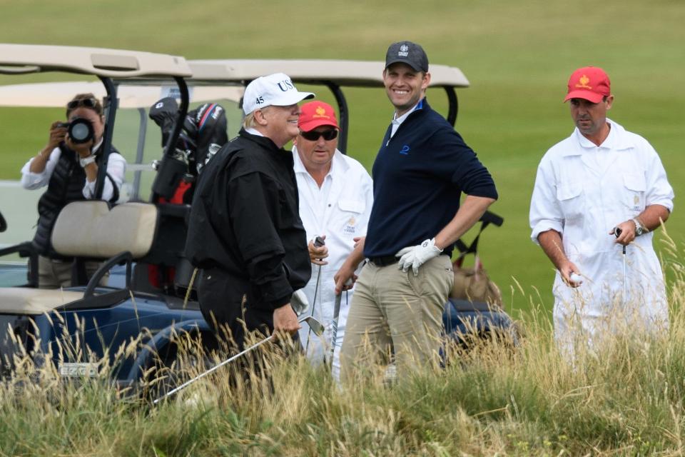  He was seen sharing a joke and smiling with his son as they went around the course