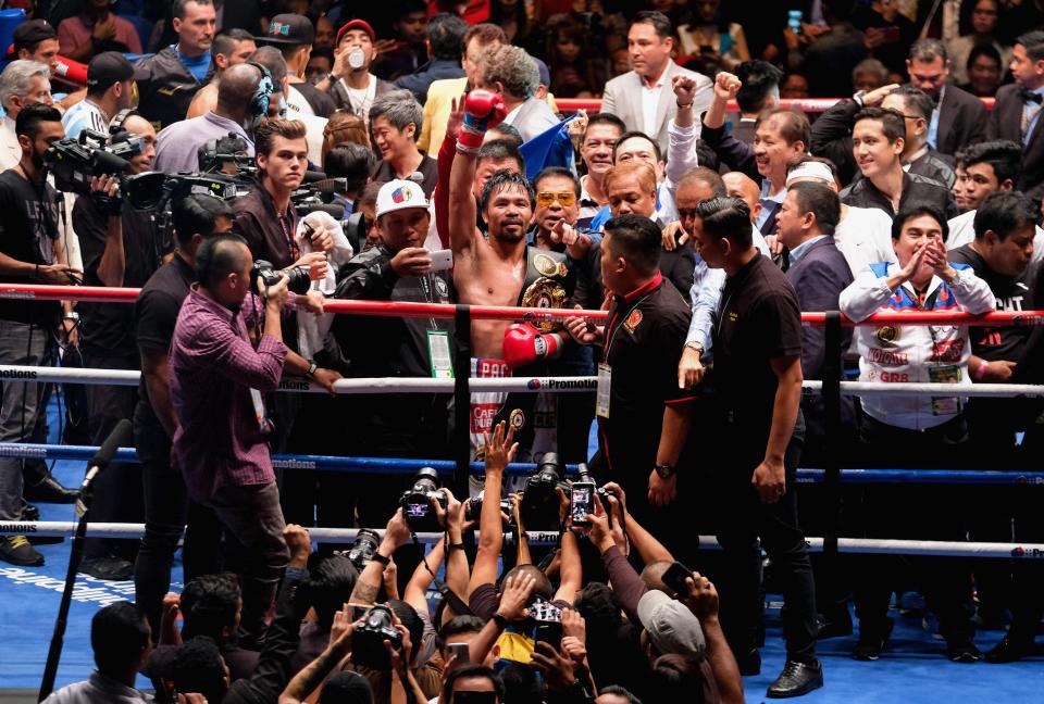 PacMan salutes the crowd after winning his latest world title