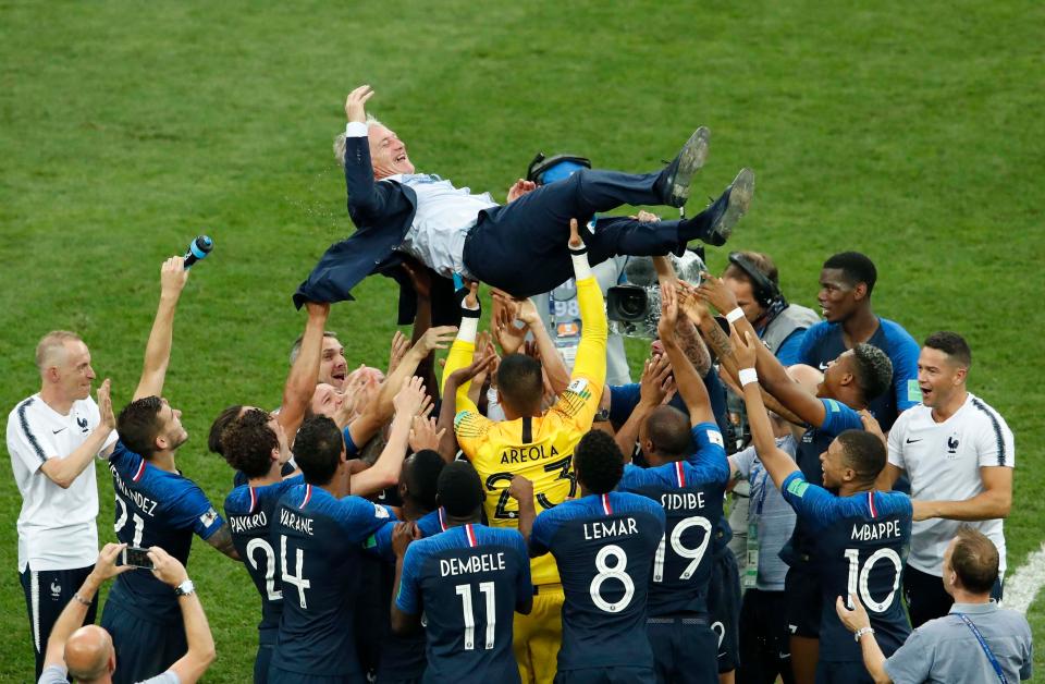 Didier Deschamps is given a lift as France celebrate World Cup victory