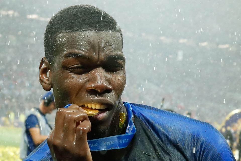 Paul Pogba poses with his medal after helping France to win the World Cup