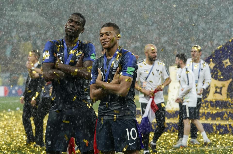 Paul Pogba and Kylian Mbappe pose after the triumph in Moscow