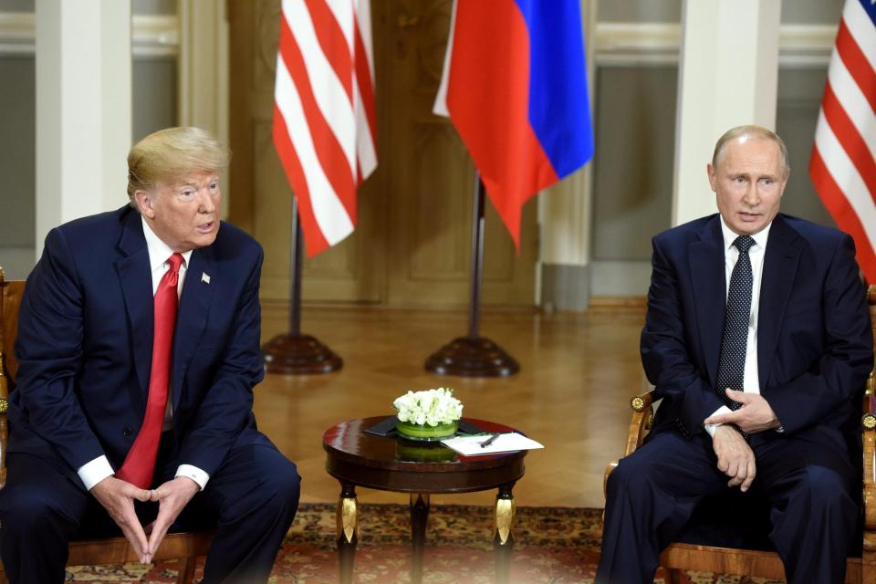  Trump and Putin both wore glum 'unsmiling' facial expressions