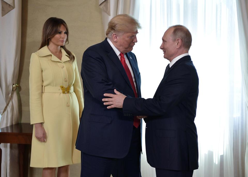  First lady Melania Trump stands nearby as Trump and Putin first meet