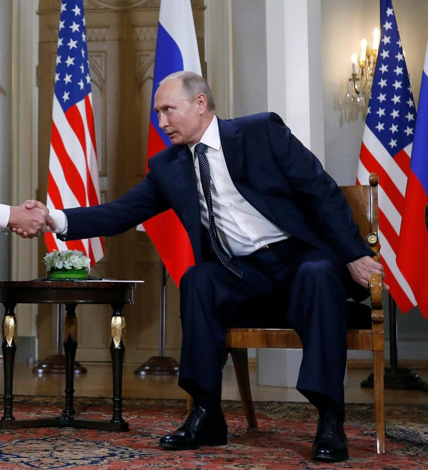 Hardman Putin was pictured clinging onto the chair