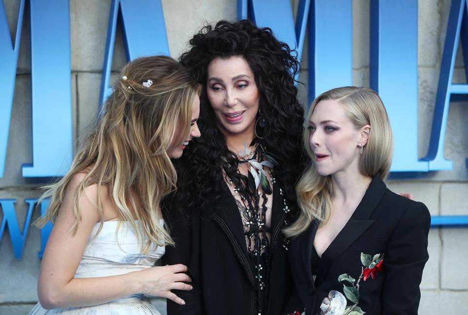  Lily James, Cher and Amanda Seyfriend in attendance at the film's premiere