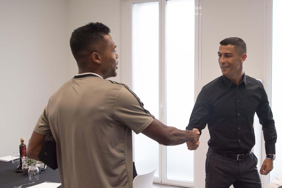 Sandro, left, was on-hand to greet Cristiano Ronaldo during his arrival at Juventus