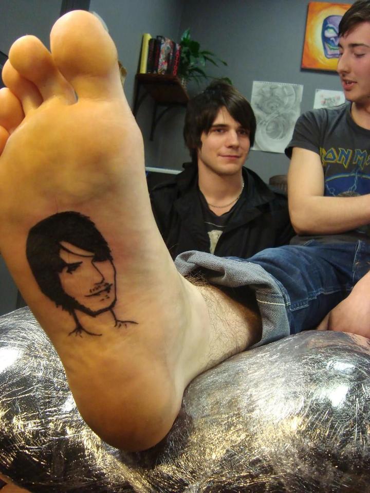  This chap got his mate's face tattooed onto his foot