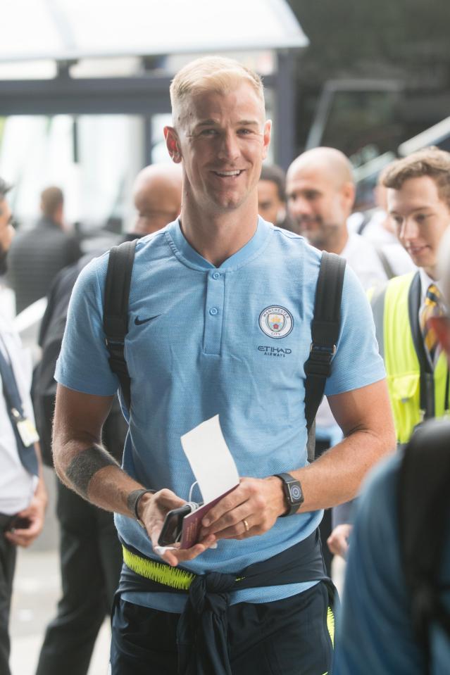 Joe Hart was all smiles as he flew out as part of the Man City squad on their tour of the US