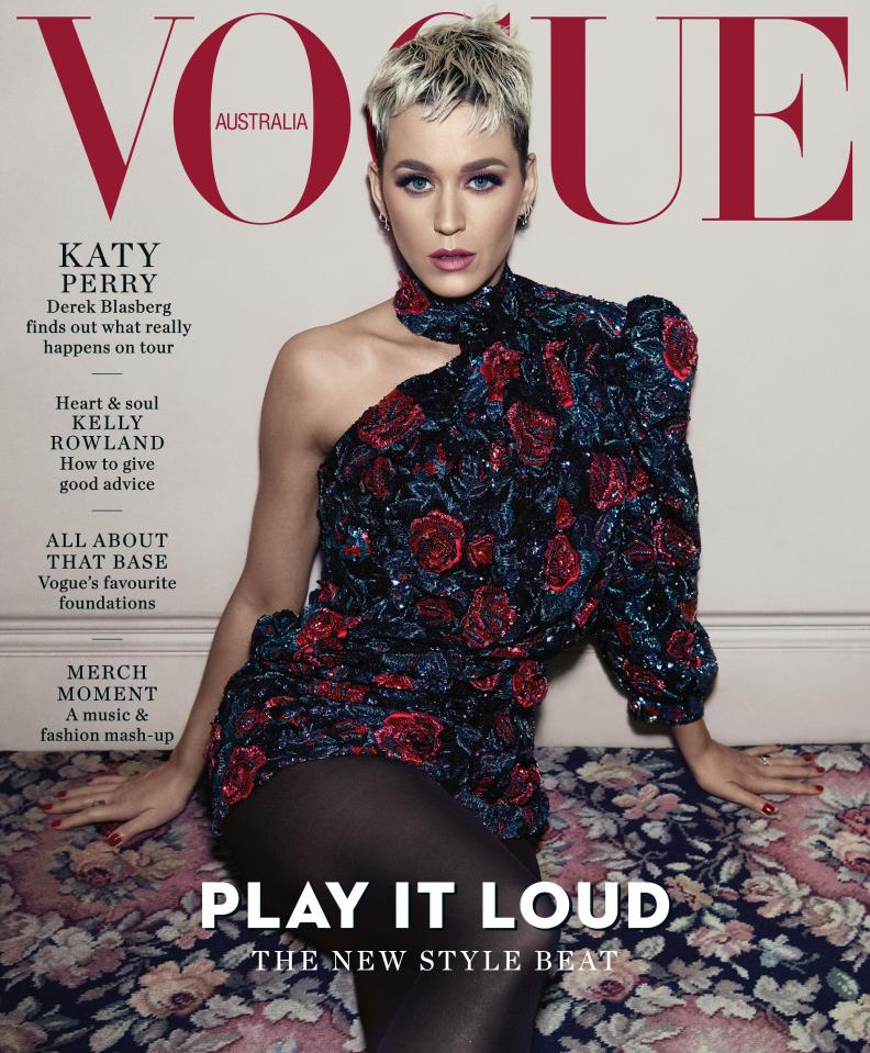  Katy posed for the edition in a rose-patterned dress and black tights