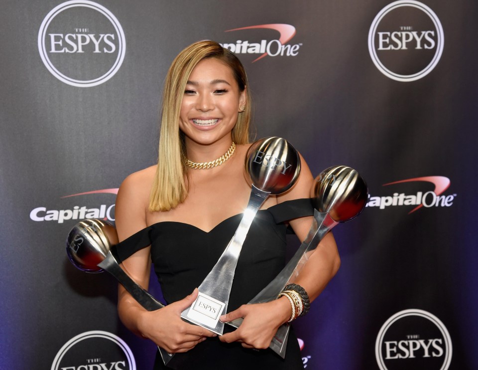 Olympic snowboarder Chloe Kim poses with her Best Female Athlete award