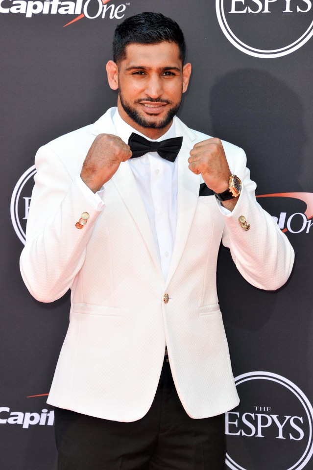 British boxer Amir Khan poses for the camera as he arrives at the ESPN event