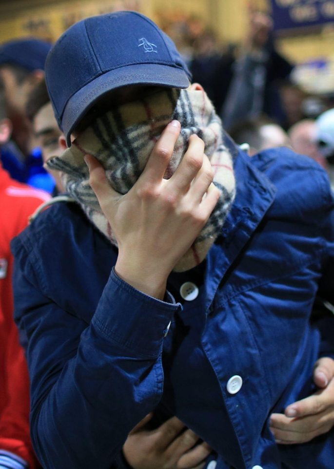 Football fans wear Burberry at a Chester v Wrexham game in 2014