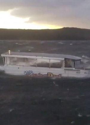  A duck boat appears to roll in the stormy waters in horrifying footage taken by a witness