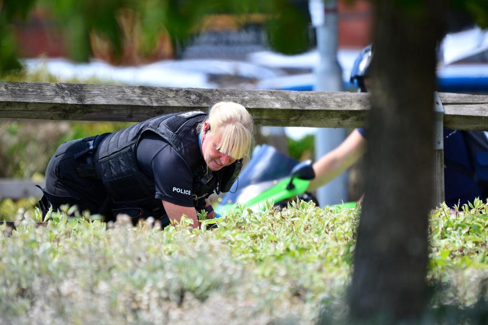  Cops searched the busy retail park as onlookers spoke of their horror