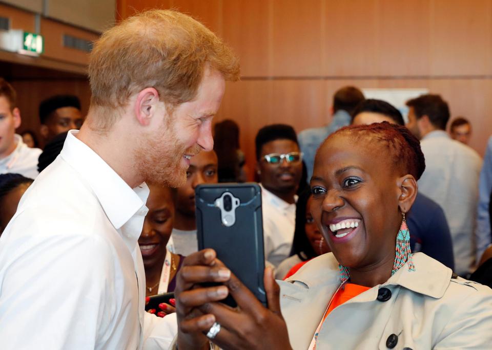  The Duke is pictured with a smiling woman at the conference