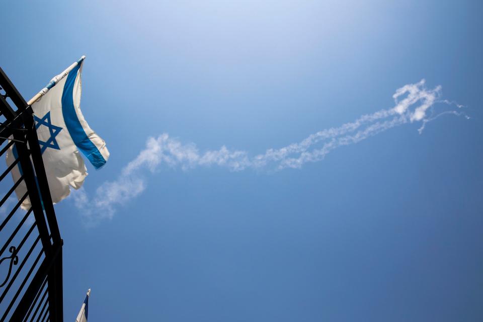  Trails of Patriot missiles are seen in the sky in northern Israel as forces shot down a Syrian fighter jet