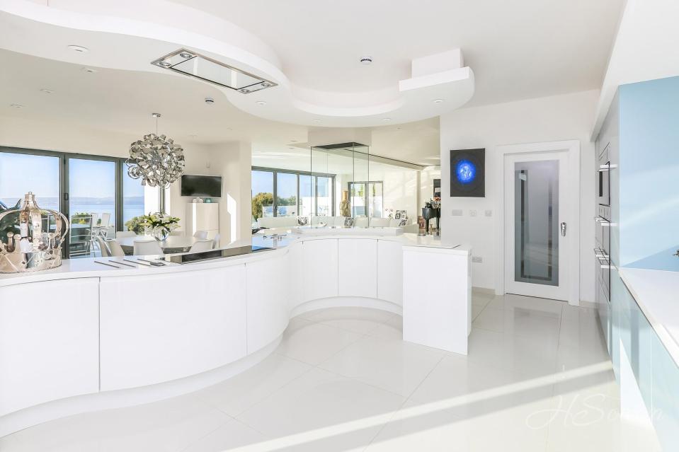  The modern open plan kitchen is fitted with all the latest appliances and gadgets