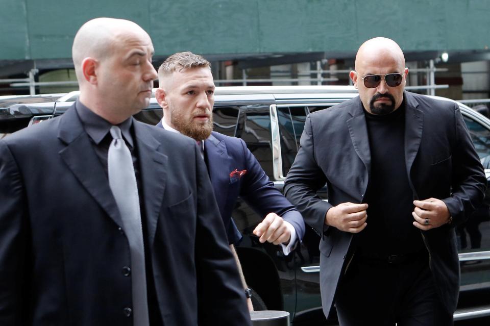 The star was flanked by his security guards as he entered the court in Brooklyn