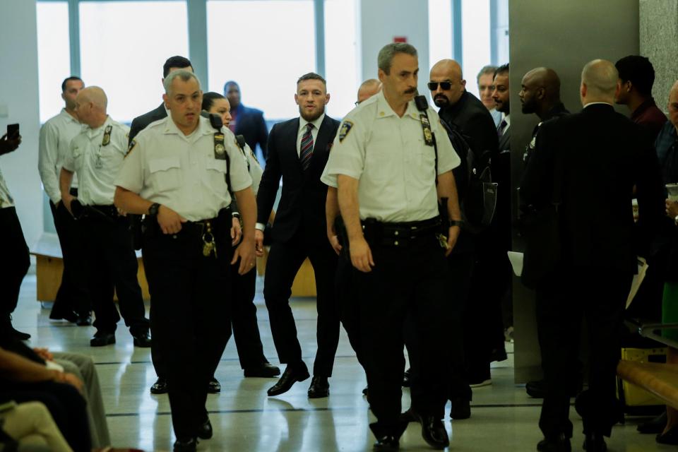 The Notorious left court surrounded by officials after entering his guilty plea