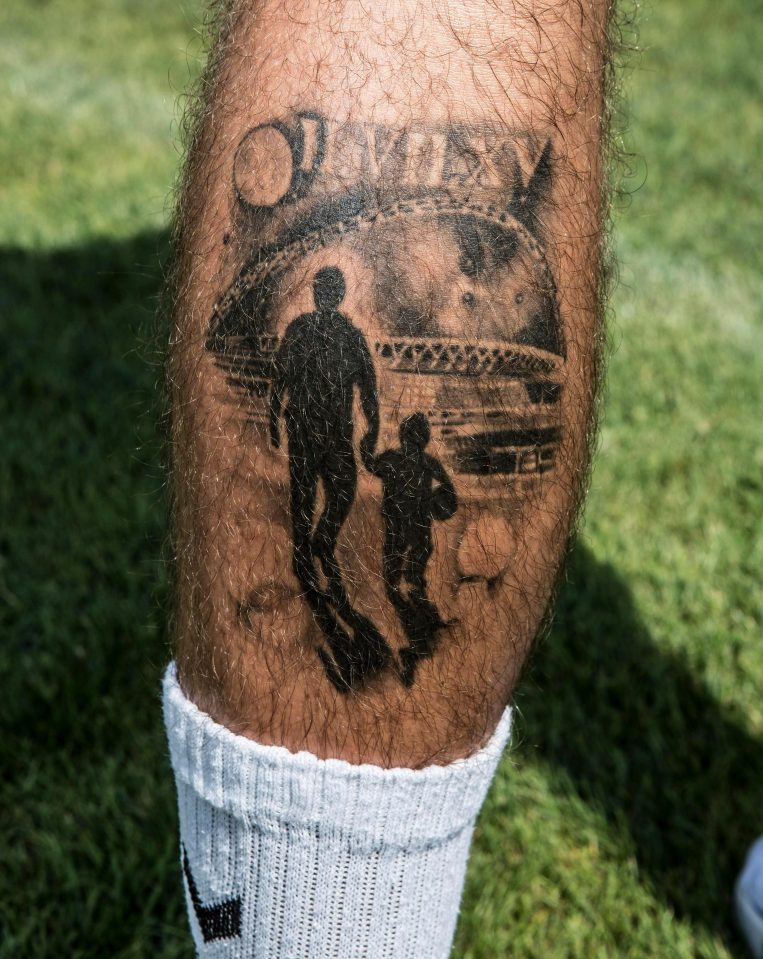  The tattoos shows a silhouette of Page and his father walking towards Wembley