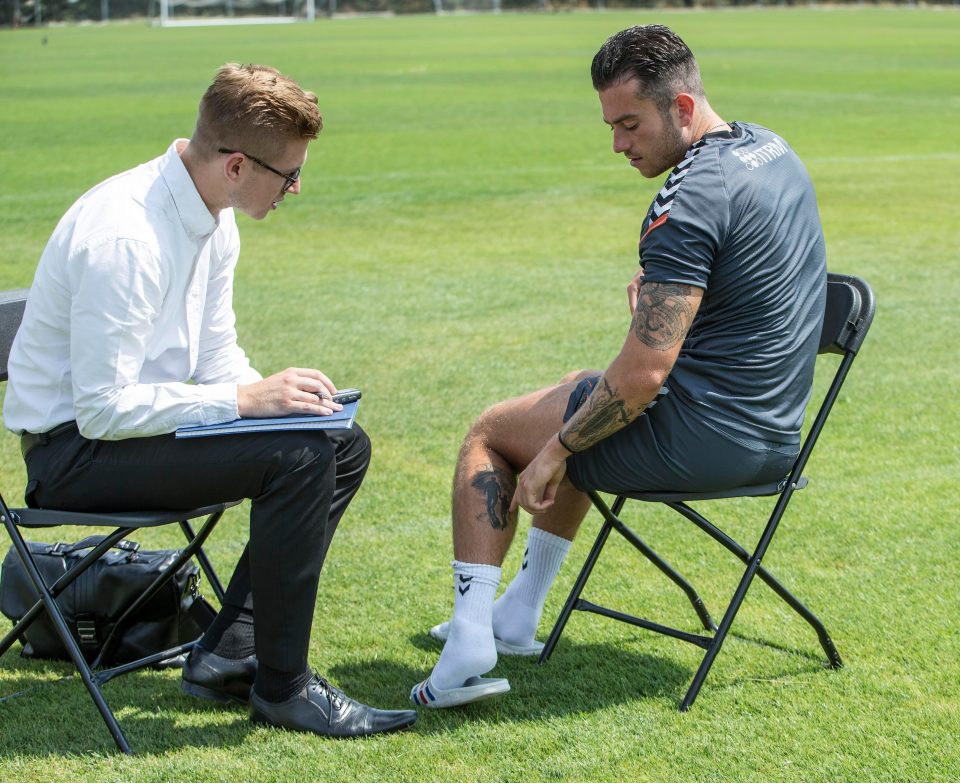  Page points out his latest tattoo of Wembley Stadium on the back of his calf