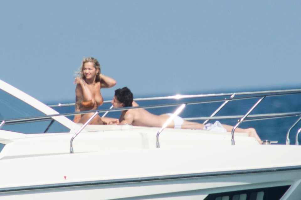 The singer was enjoying a boat trip off the coast of Barcelona and looked stunning in a gold two-piece