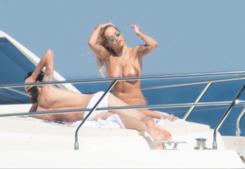 Rita Ora was seen lounging on a yacht with a male friend