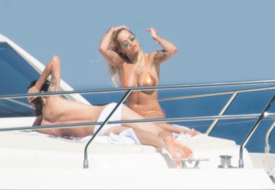  Rita Ora was seen lounging on a yacht with a male friend