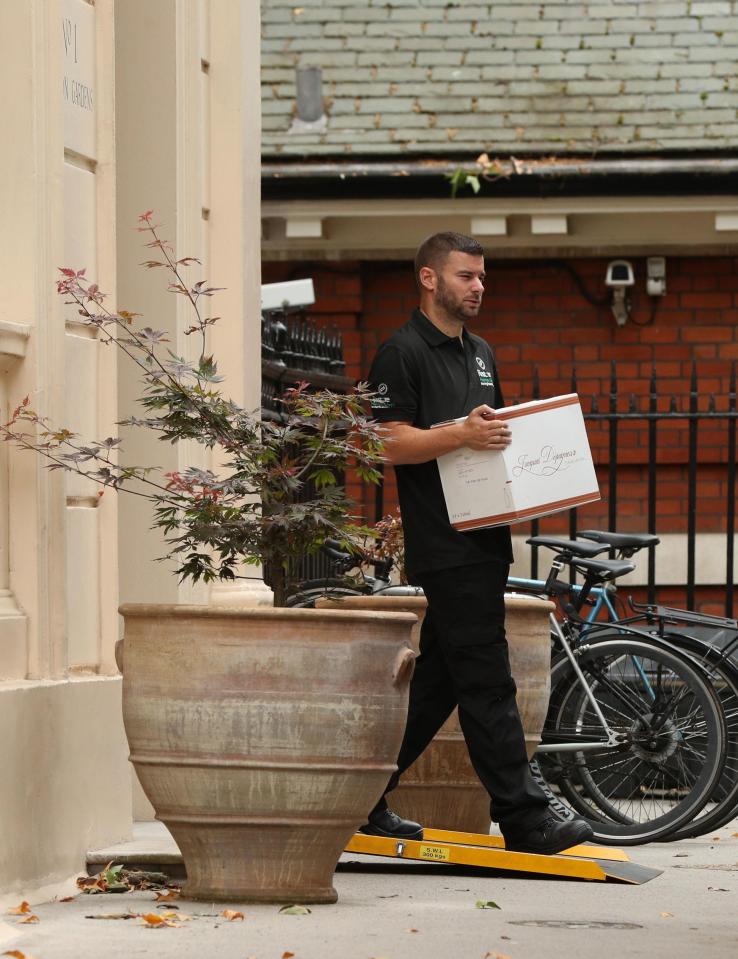  Removal men have been spotted loading up a Boris Johnson's cases of French wine from his former official ministerial residence