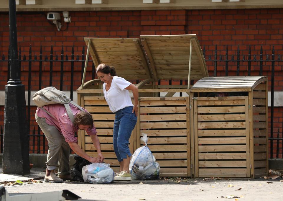  His wife Marina and son Milo were seen putting the bins out at the property