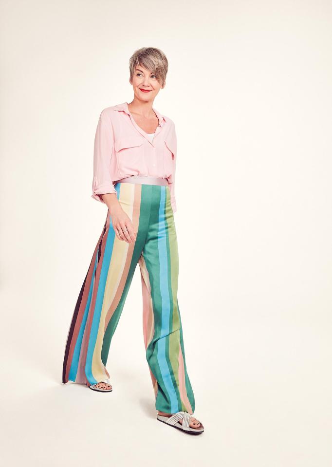  Tracey Lea Sayer matches her bold stripey trousers with a pink shirt from Zara and Dune sandals