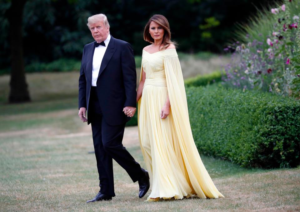  Melania stepped out in a floor-grazing lemon gown this evening for a dinner at Blenheim Palace