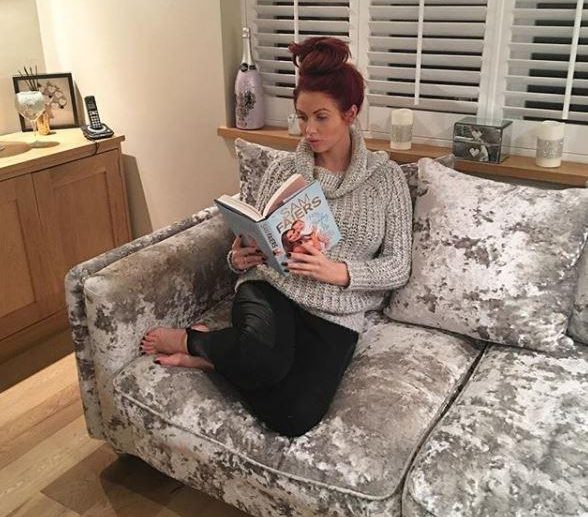  Amy loves snuggling on her crushed velvet chairs with a Sam Faiers' book