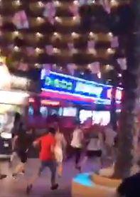  The footage shows the terrified Brits rushing away in total confusion as shots rang out