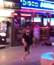  One lad can be seen hitting the deck while another makes a run for it