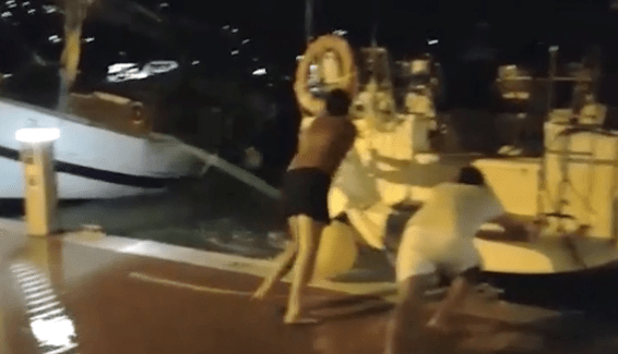 Horrifying footage shows two men – barefoot and wearing shorts – trying to stop their luxury boat sweeping off into the harbour