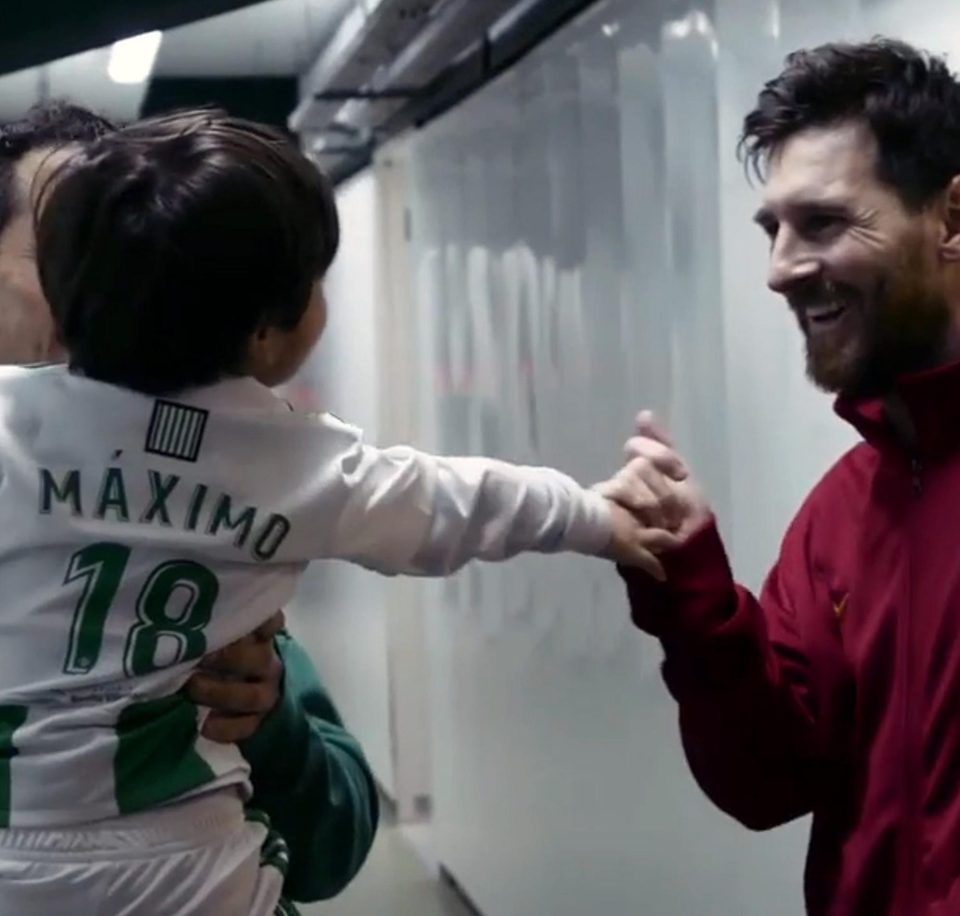  Lionel Messi meets two-year-old Maximo after the tot's dad knocked on the door of the Barcelona dressing room