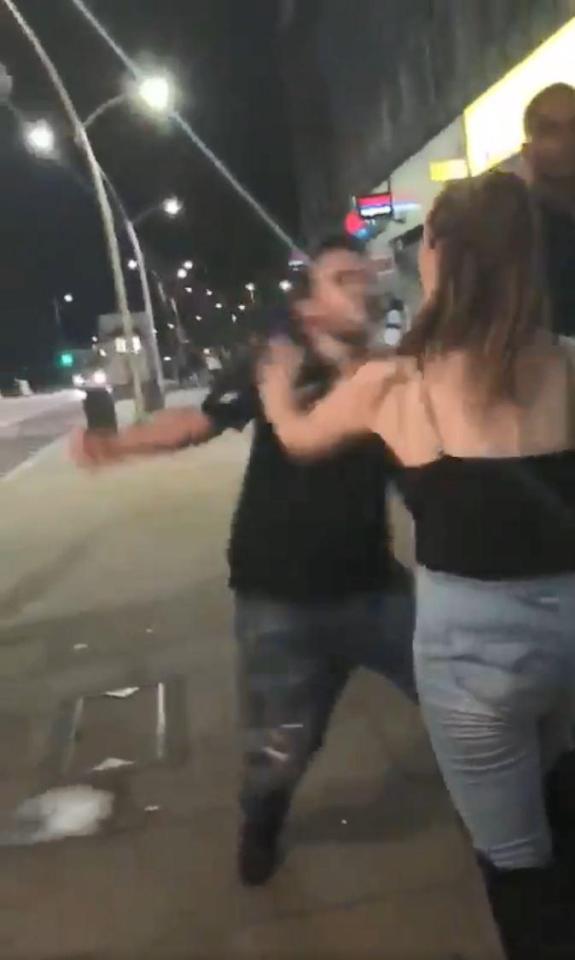  After she comes at him again, the man throws a second punch, knocking her out cold