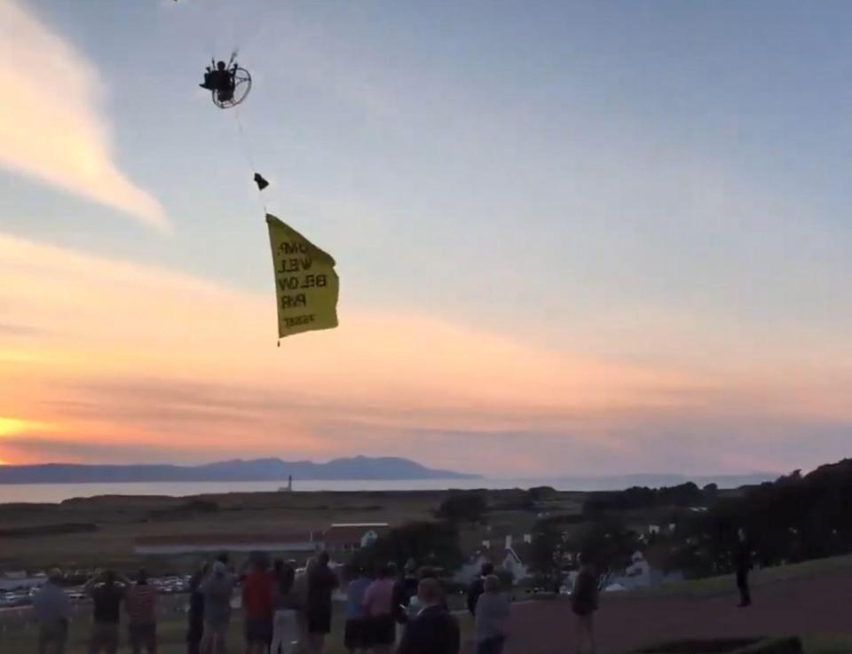  The President looks to the sky with concern as the paraglider swoops in