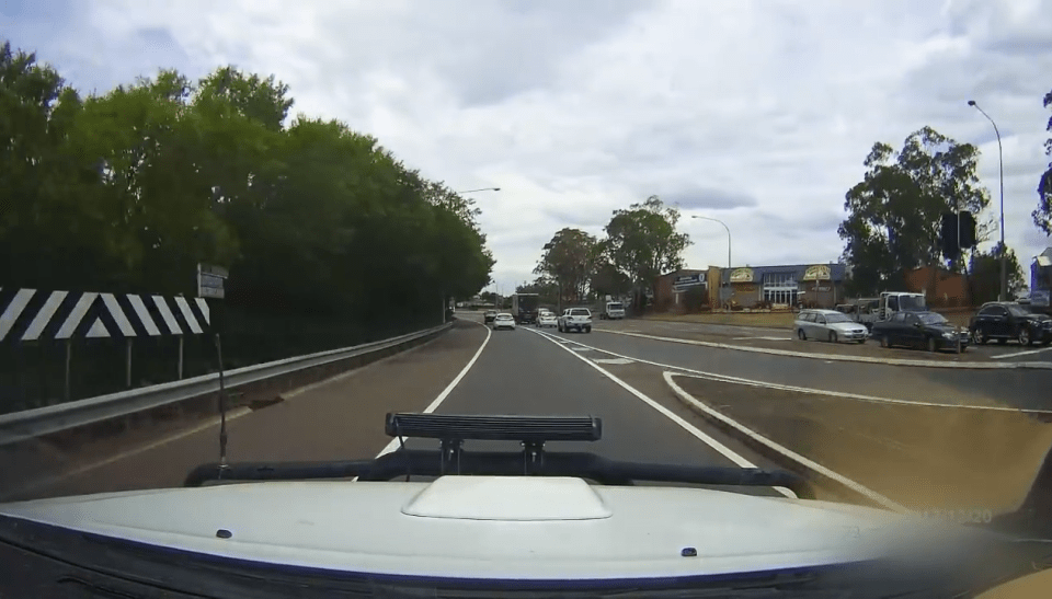  The video begins as the driver approaches a two lane road