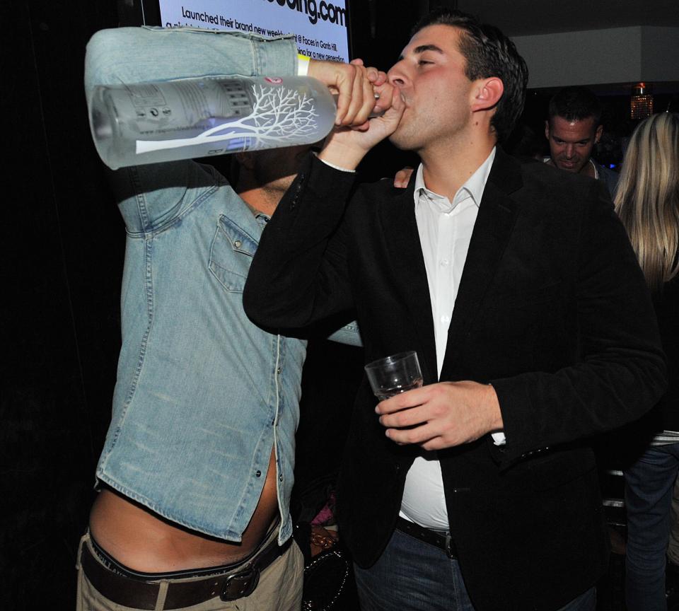  Arg celebrates by downing a drink at Faces nightclub in Essex