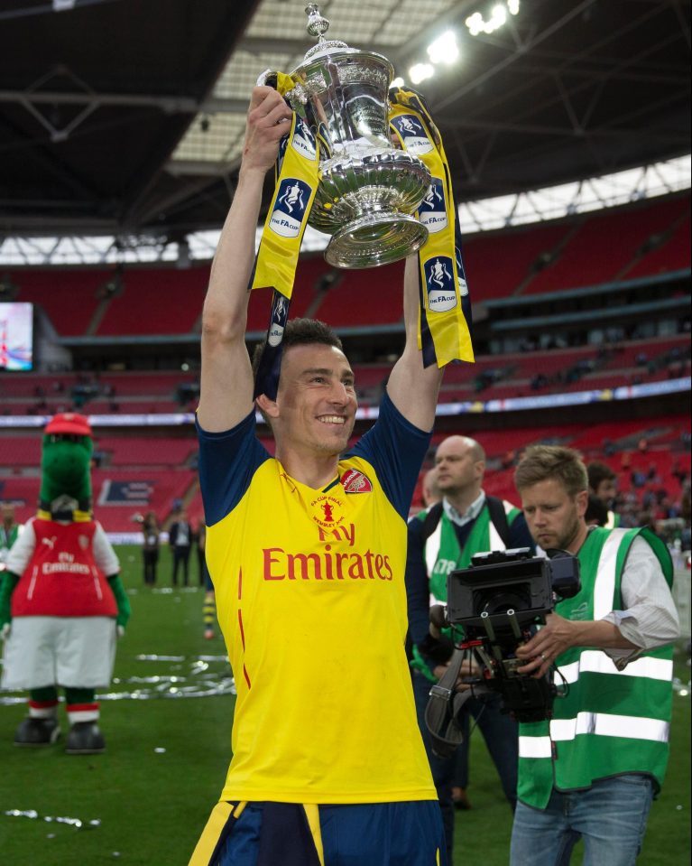 Laurent Koscielny celebrates lifting the FA Cup in 2015