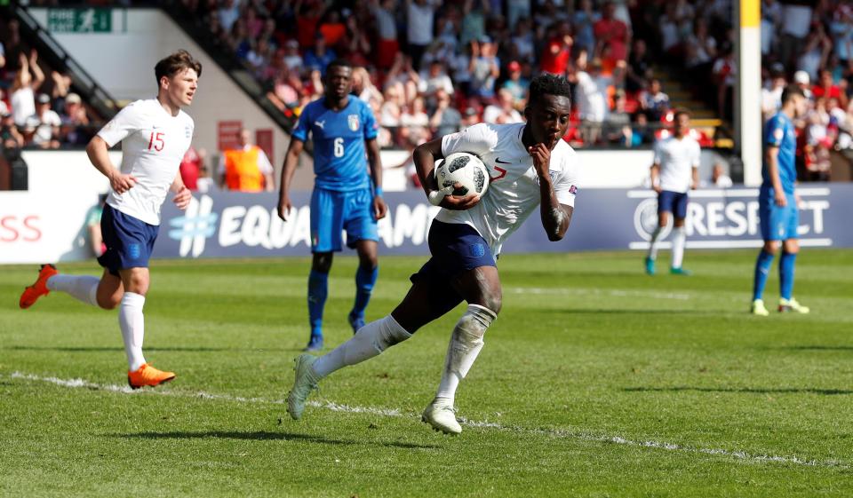 Appiah celebrates his solo goal against Italy