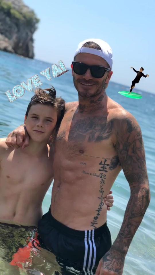  Becks posed in the sea with son Cruz, 13