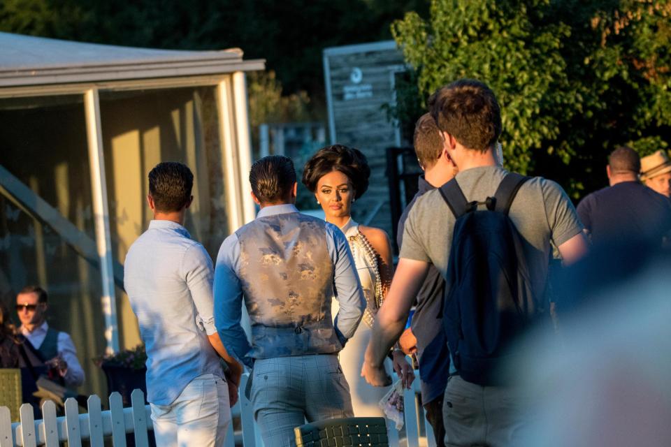  Leah Fletcher, in the white dress, takes part in filming for the new reality TV show