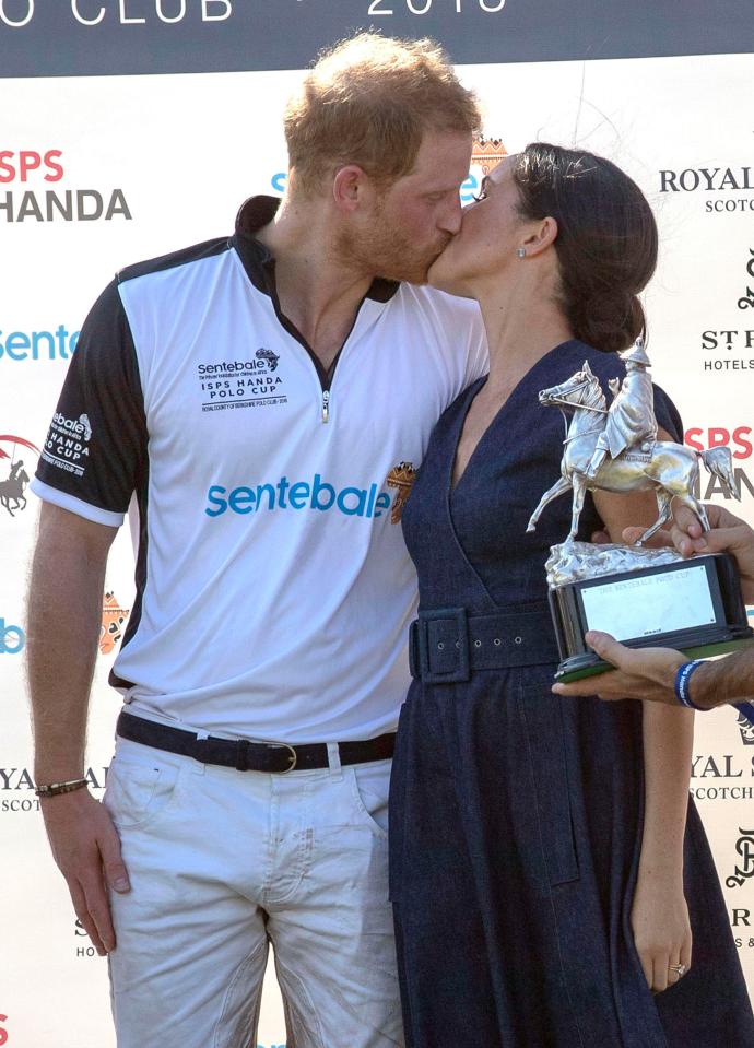  Meghan was snapped giving her husband a kiss after a polo match