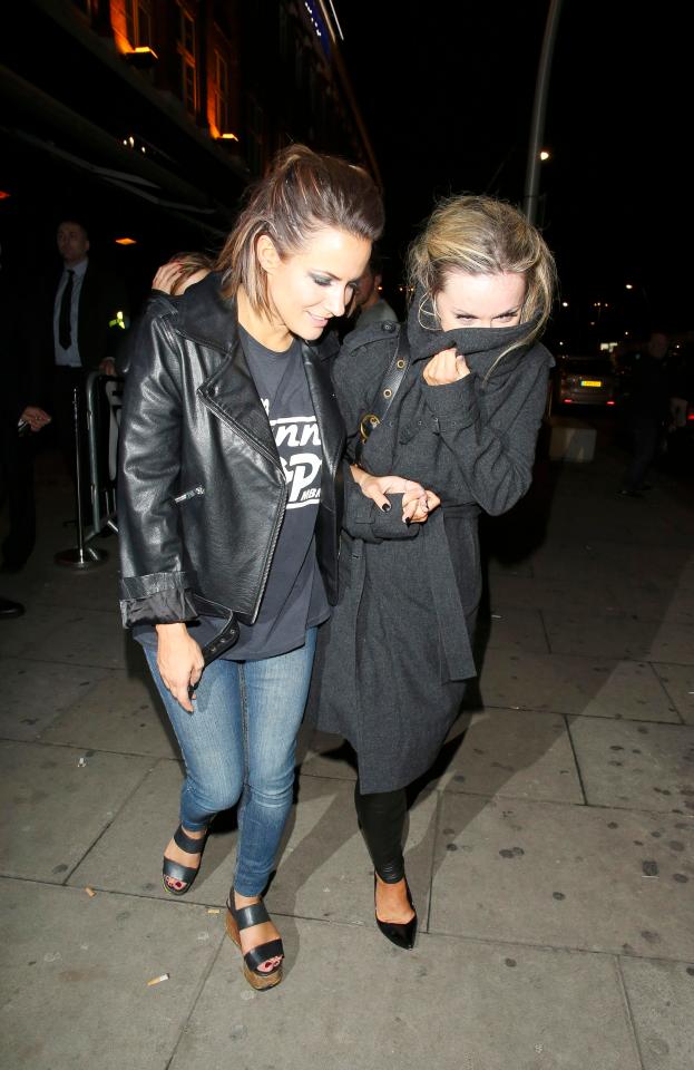  Love Island presenter Caroline Flack hugs Strictly star Ola Jordan outside Faces nightclub in 2014