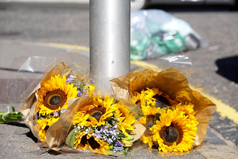  Friends and family have laid floral tributes at the scene