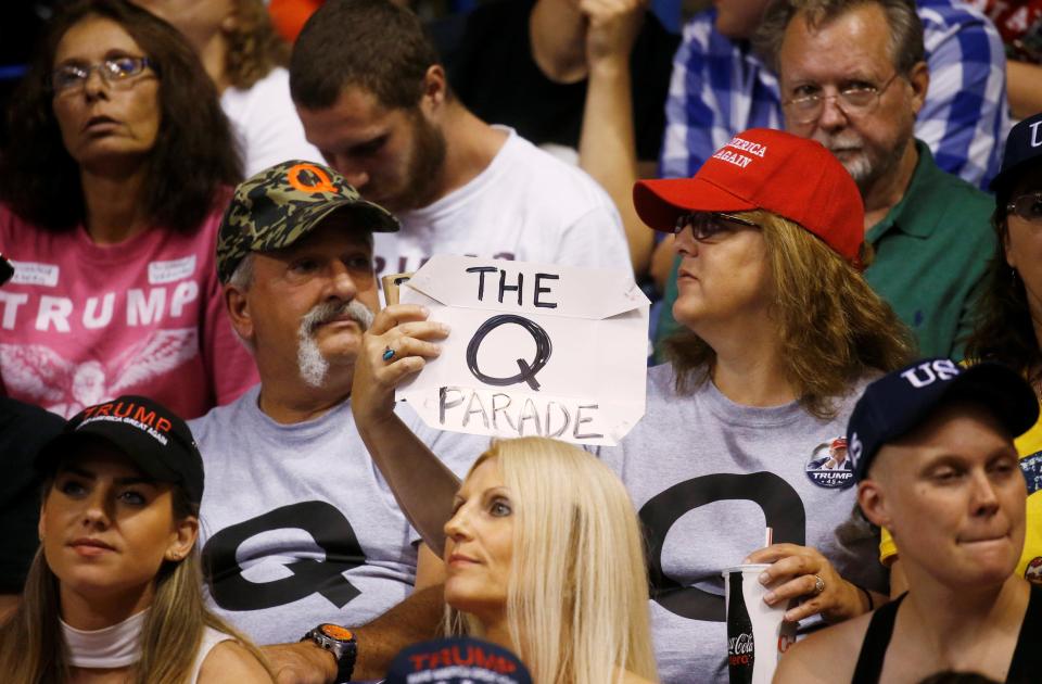  The many people who turn up to Trump's rallies holding Q signs are believers in a dangerous new conspiracy theory movement