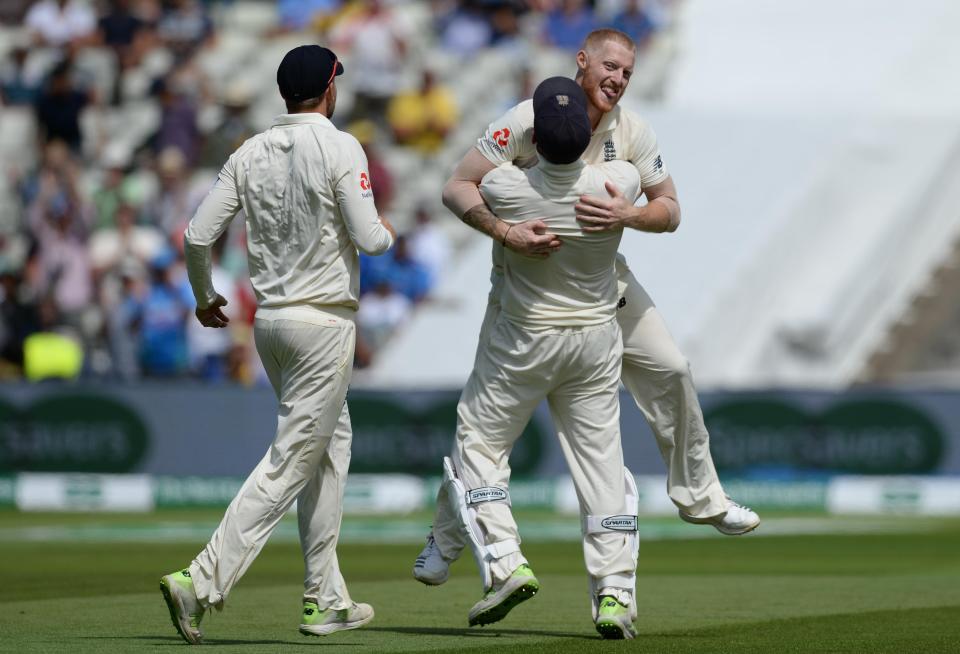  England players celebrate after beating India in the first Test